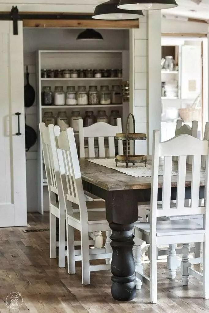 mall, narrow pantry with open wooden shelving and glass jar storage.