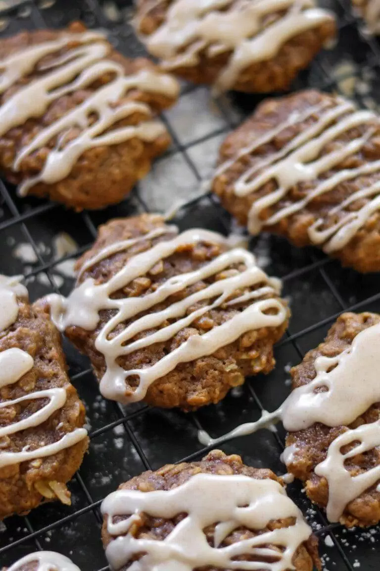 A beautiful arrangement of pumpkin oatmeal cookies, each drizzled with a sweet cinnamon maple glaze