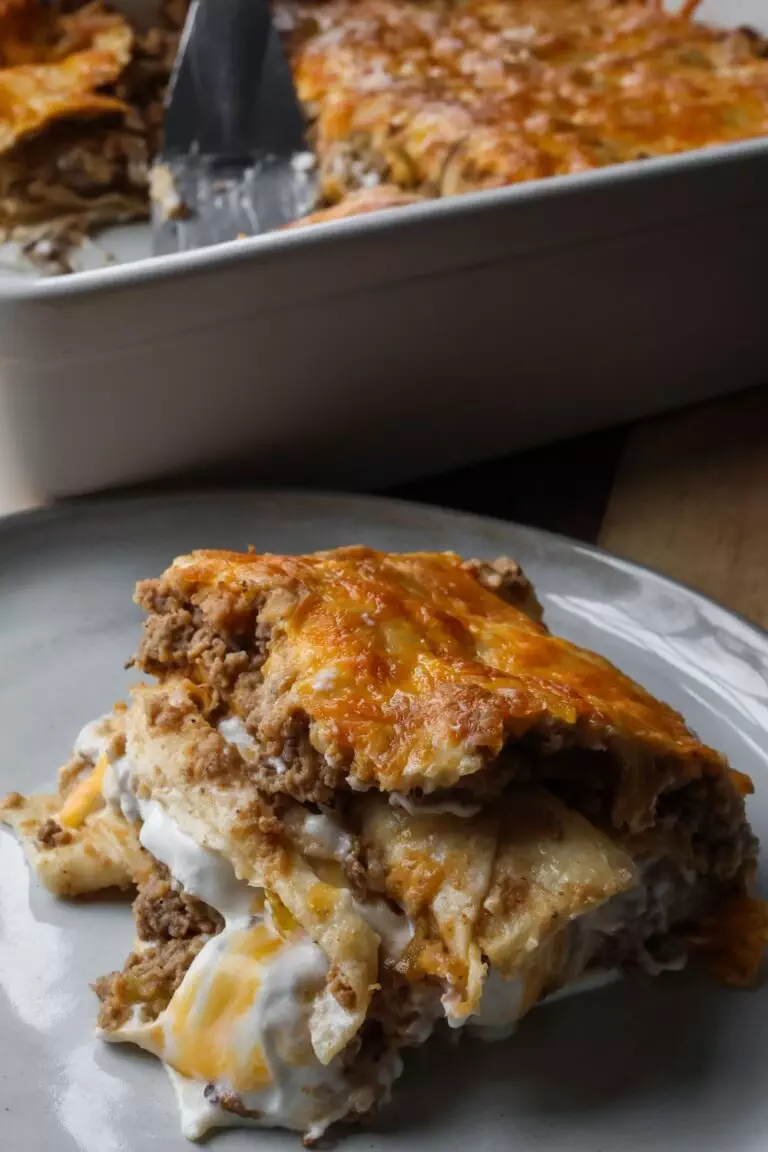 homemade creamy burrito casserole on a white plate