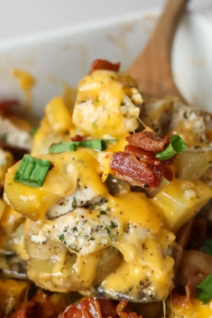 A serving of Chicken Potato Casserole garnished with green onions